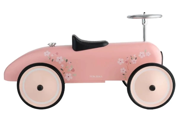 Metalen roze loopauto met bloemen